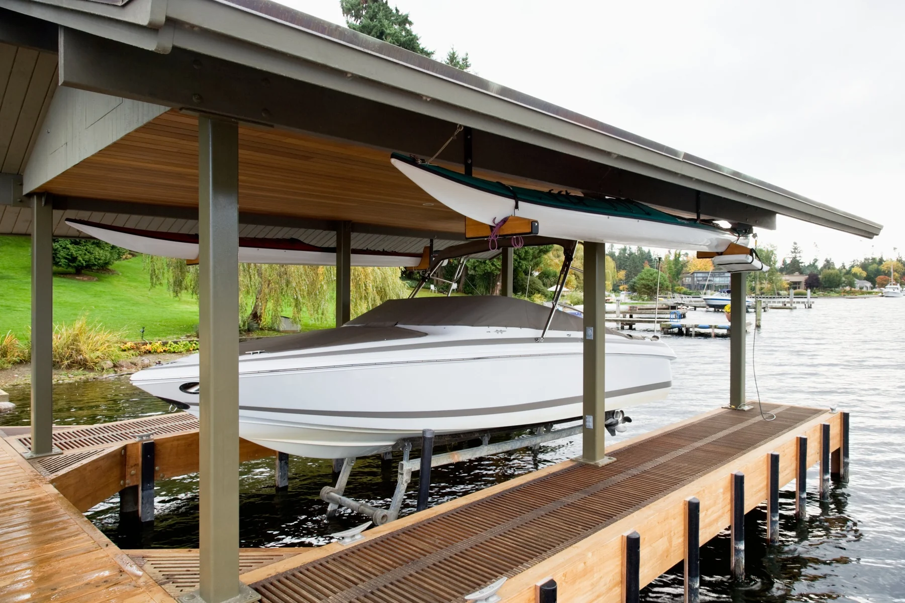 Photo. Dock repair and restoration — restored dock on the water, golden hour